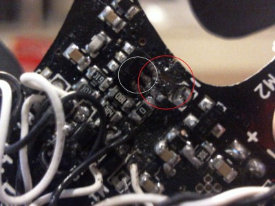 the red ring is where the component broke of and the white ring is where the smoke came from